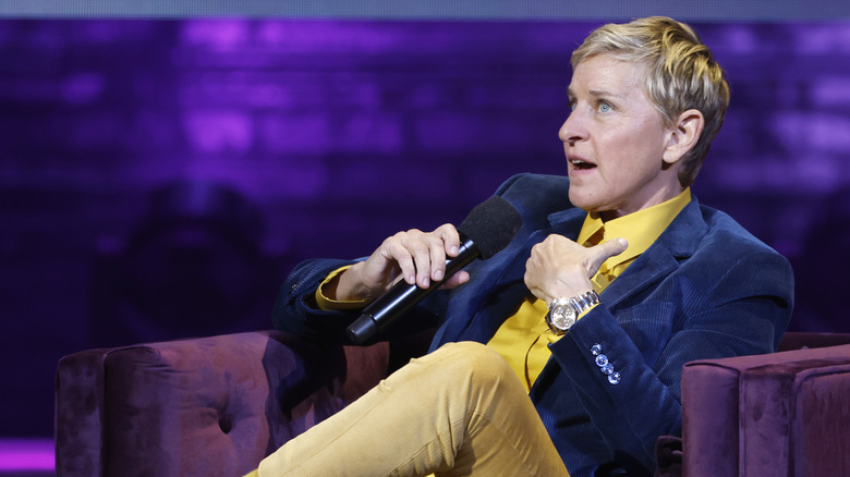 Ellen DeGeneres speaking into microphone