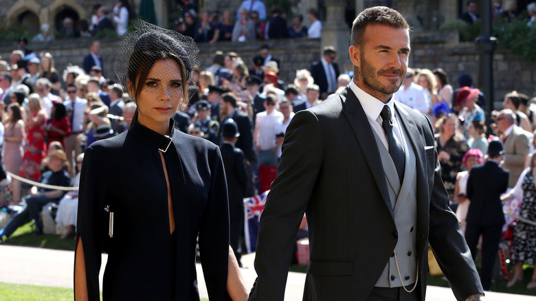 Victoria and David Beckham walking