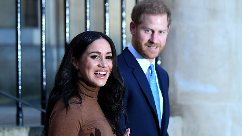 Prince Harry and Meghan Markle smiling