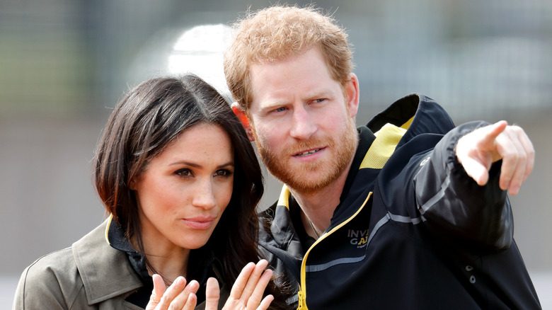 Meghan Markle and Prince Harry attending sports event