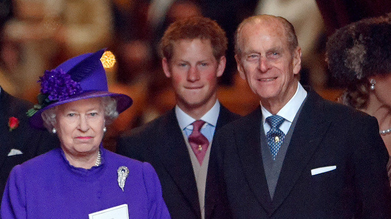 Prince Harry with Queen Elizabeth and Prince Philip in 2004