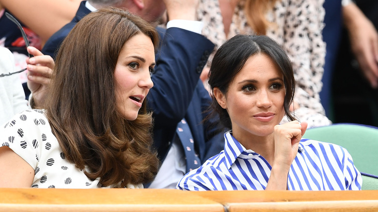 Kate Middleton talking to Meghan Markle 