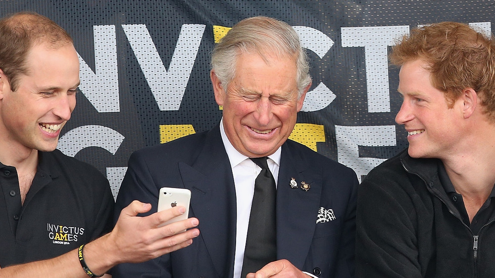 Prince Harry, Prince William and Prince Charles smiling