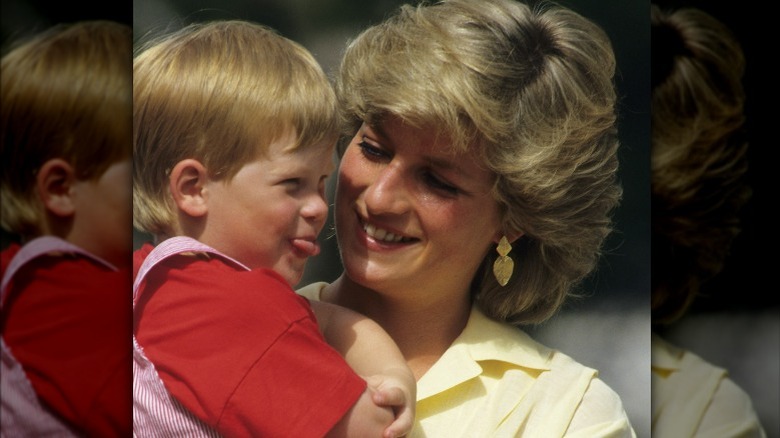 Princess Diana smiling at Prince Harry