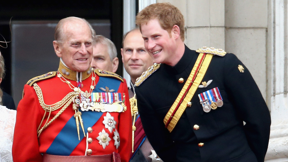 Prince Philip and Prince harry laughing together 