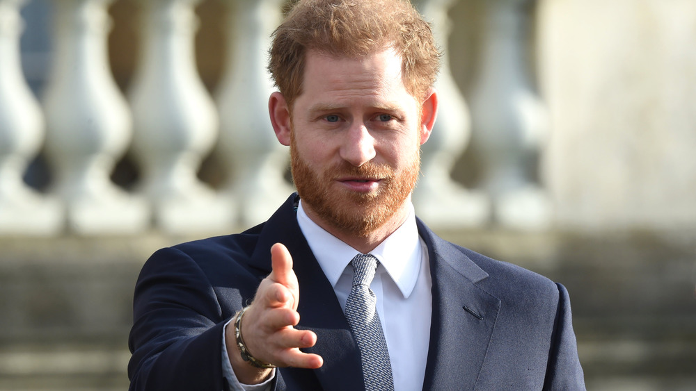 Prince Harry reaching out his hand