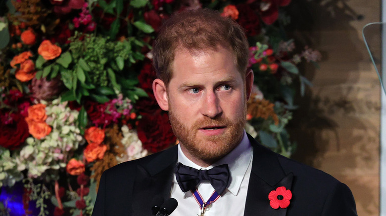 Prince Harry in tux speaks on stage as Intrepid Museum hosts Annual Salute To Freedom Gala 