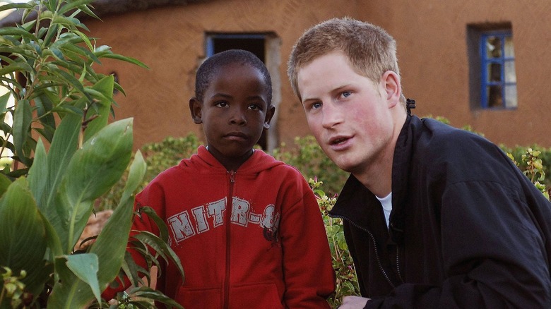 Prince Harry with African child