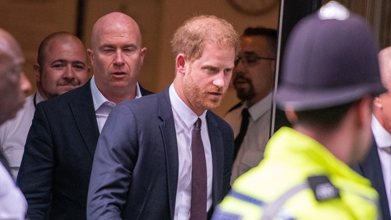 Prince Harry outside of a courthouse