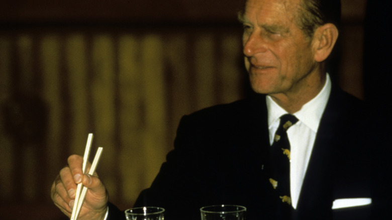 Prince Philip with chopsticks 