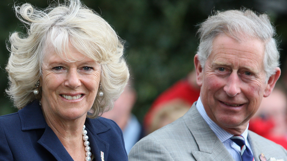 Camilla Parker-Bowles and Prince Charles outdoors