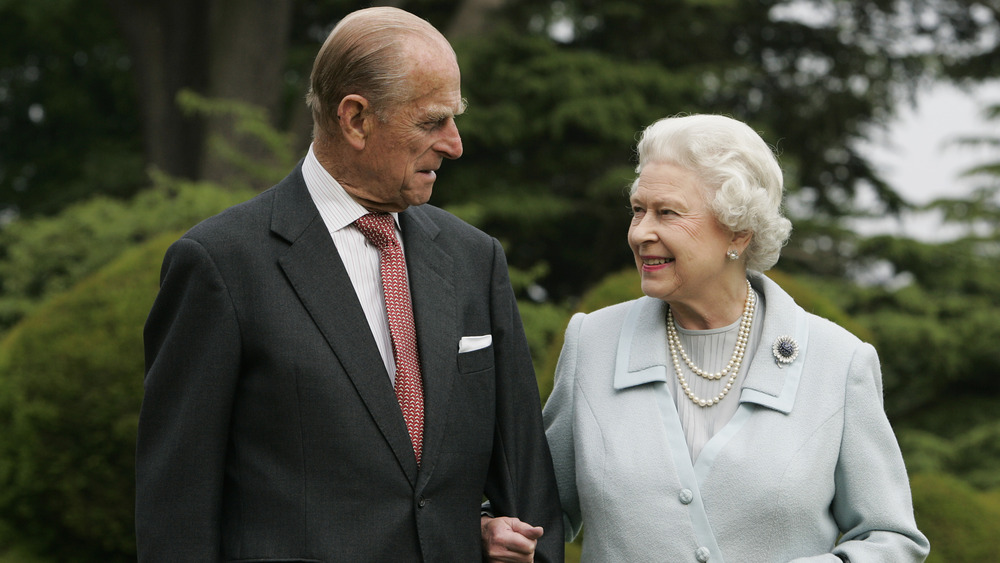 Prince Philip and the queen walk together