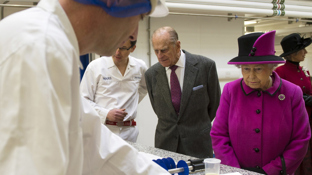 Prince Philip and Queen Elizabeth during factory tour