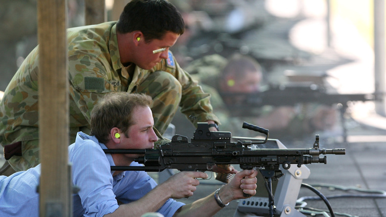 Prince William aiming a military weapon 