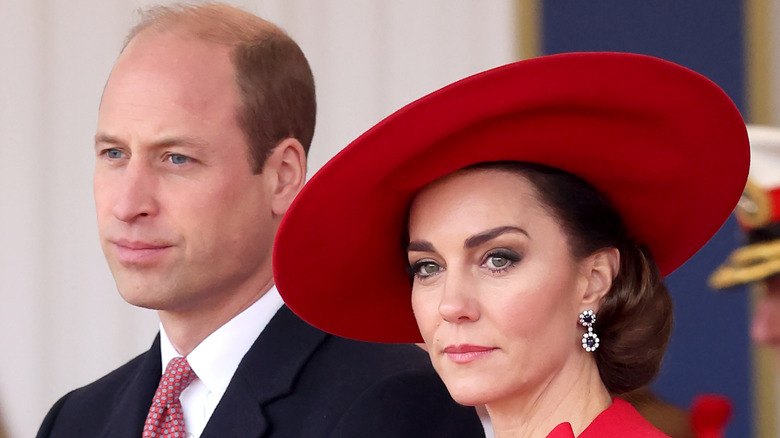 Prince William and Kate Middleton looking serious in close-up