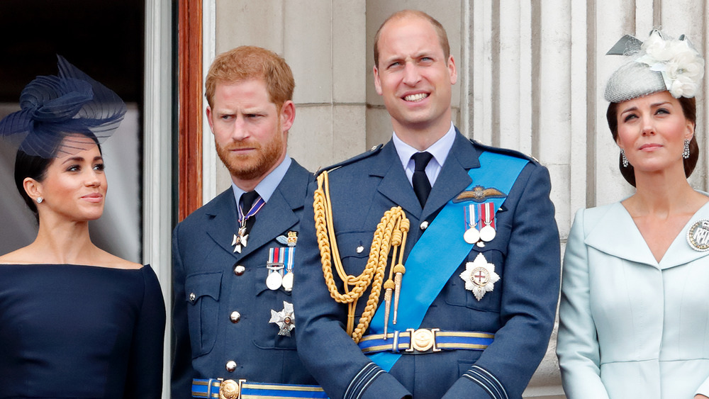 Meghan Markle, Prince Harry, Prince William, and Kate Middleton standing together