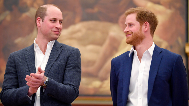 Prince William smiling at Prince Harry