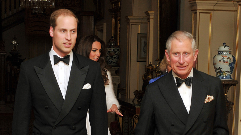 Prince William walking with Prince Charles