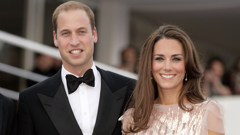 Prince William and Kate Middleton smiling at formal event