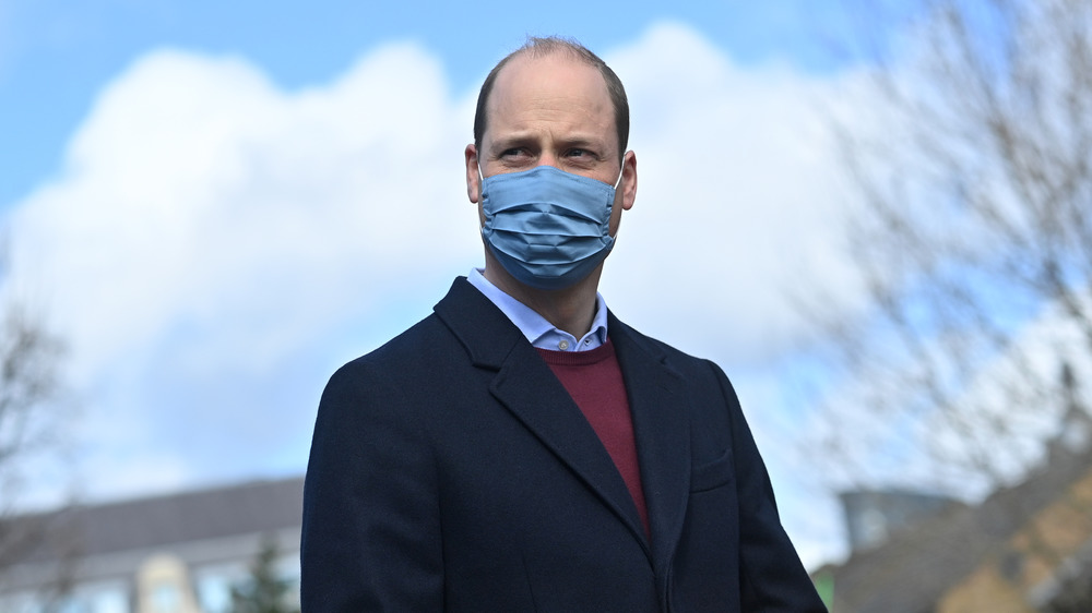 Prince William responding to questions from reporters at an event