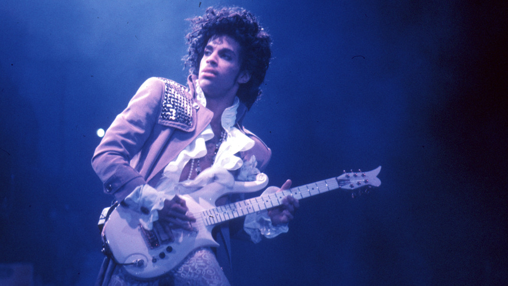 Prince playing the guitar