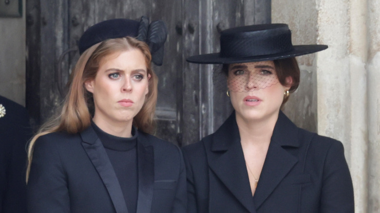 Beatrice and Eugenie at funeral