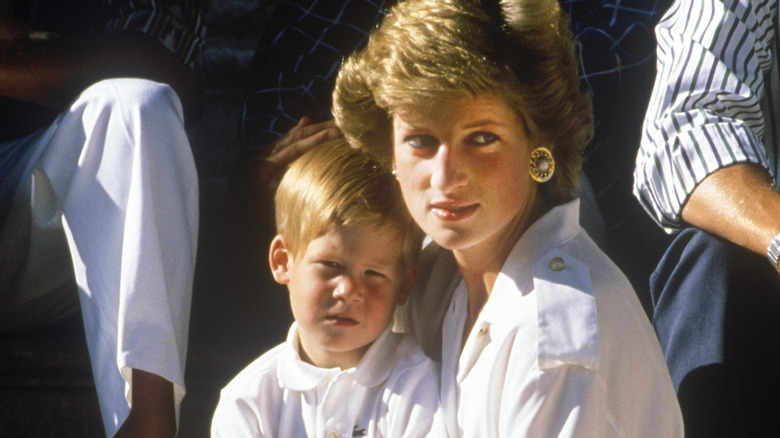 Princess Diana holding Prince Harry 