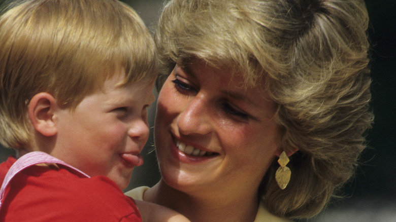 Princess Diana holding baby Prince Harry