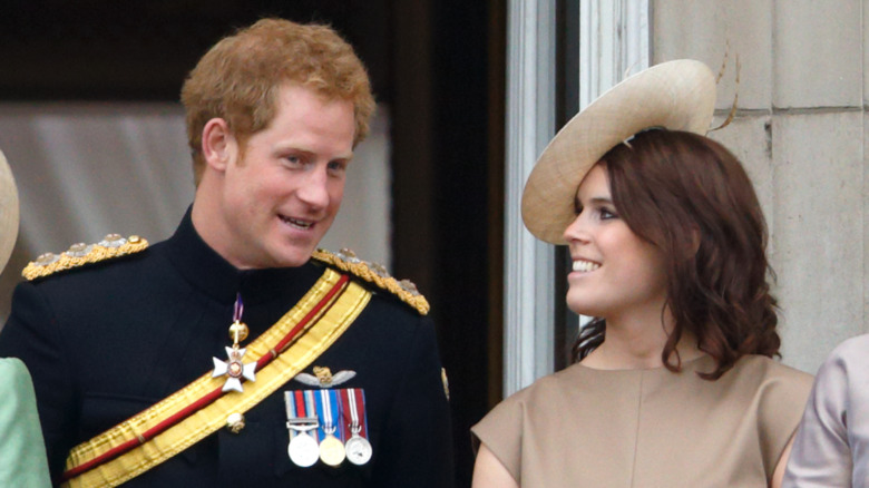 Prince Harry and Princess Eugenie talking and smiling 