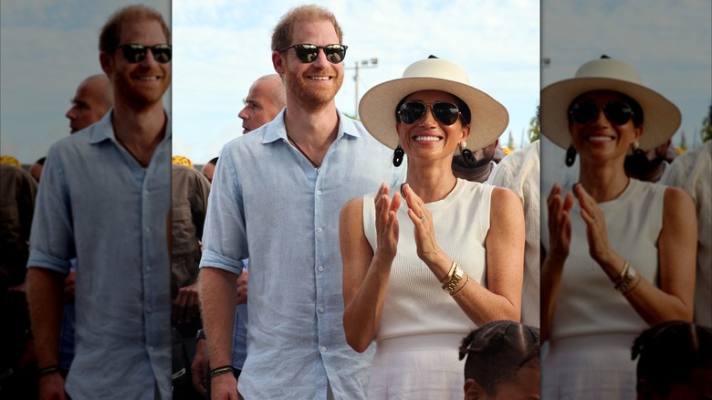 Prince Harry and Meghan Markle smiling and wearing sunglasses outdoors