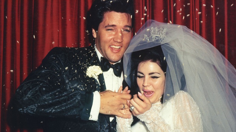 Elvis Priscilla Presley laughing wedding day confetti