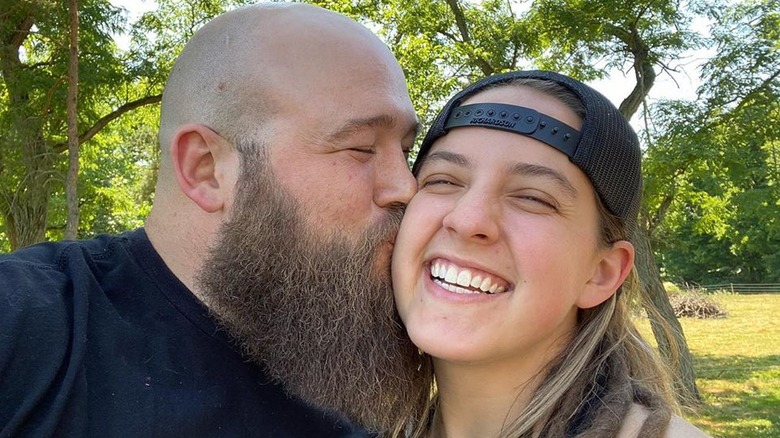 Sarah Logan and Raymond Rowe kissing in a selfie