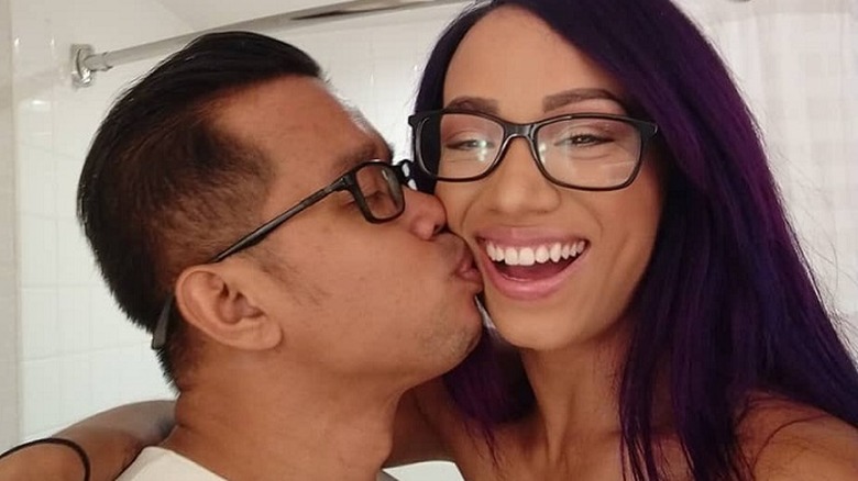 Sasha Banks and Mikaze embracing in a selfie