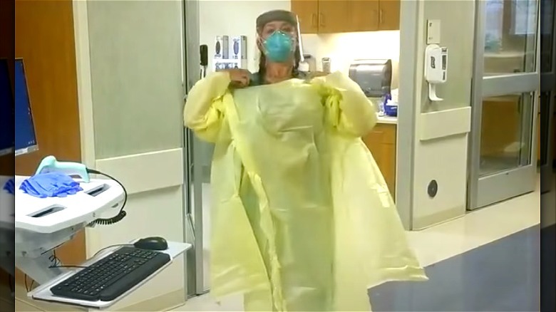 Carole Mazer puts on PPE