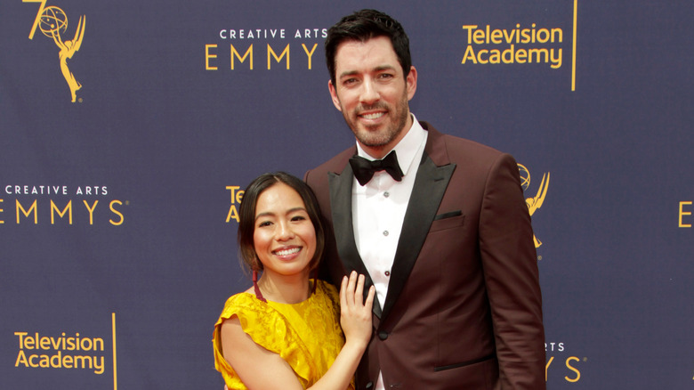 Drew Scott and Linda Phan pose 