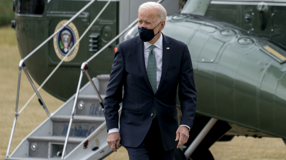 Joe Biden walking in front of a helicopter