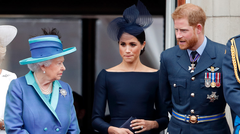 Queen Elizabeth, Meghan Markle, and Prince Harry