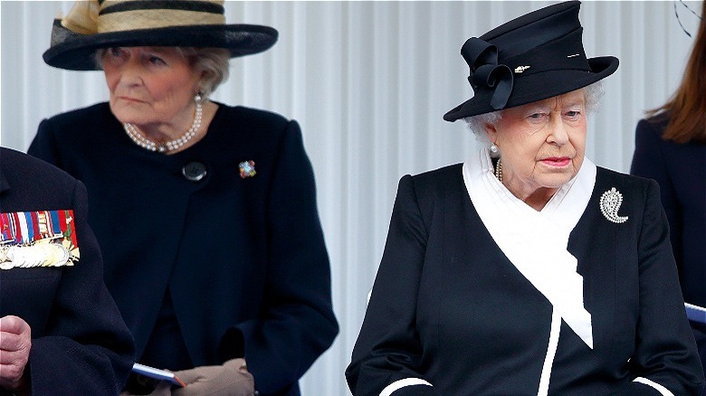 Queen Elizabeth II sitting with Lady Diana Farnham