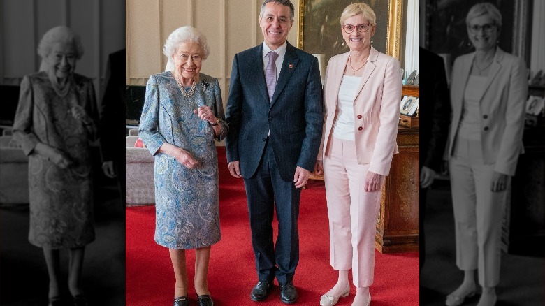 Queen Elizabeth, Ignazio Cassis, and Paola Cassis smiling