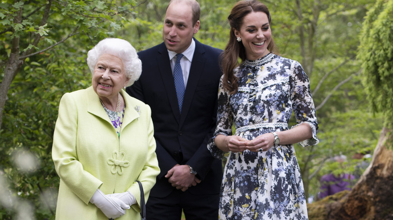 Queen Elizabeth II, Prince William, and Kate Middleton laughing