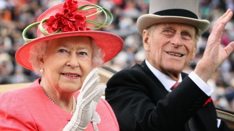 Queen Elizabeth and Prince Philip smile