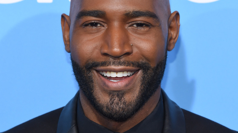 Karamo Brown smiles on red carpet