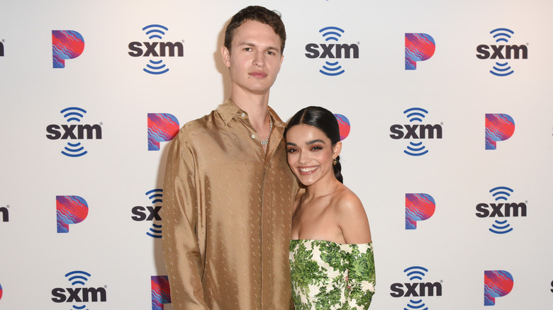 Ansel Elgort and Rachel Zegler arm in arm 