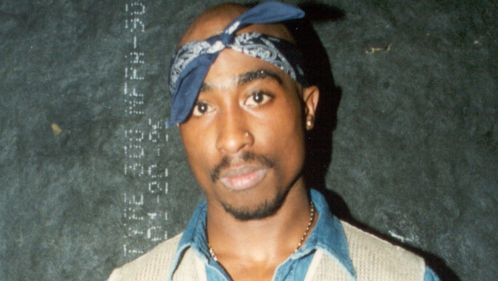 Tupak Shakur wearing a bandanna