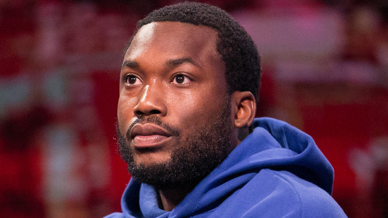 Meek Mill wearing a blue hoodie