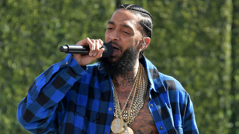 Nipsey Hussle performing with mic