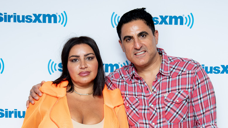 Reza Farahan and Mercedes Javid posing