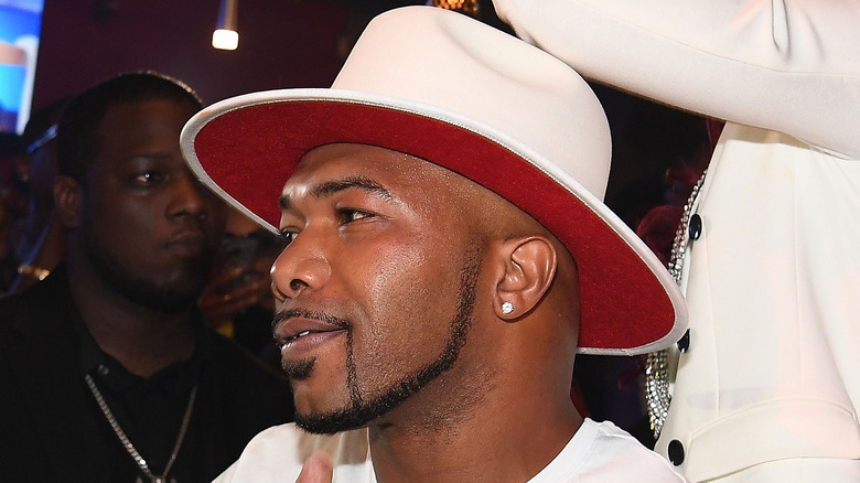 Maurice Fayne smiling wearing white hat