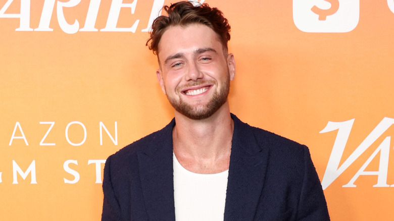 Harry Jowsey smiling for photographers at a Variety event