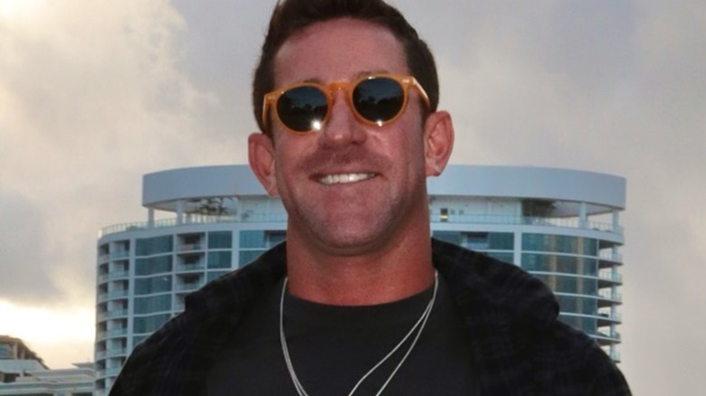 Pete Hunziker smiling in sunglasses while walking in October 2024